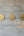 KIFF KIFF Amal gold hammered metal dove ex-voto wall decorations arranged in a row on a grey concrete wall