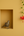 KIFF KIFF handcrafted brass Dhokra parrot statue in a wall niche next to a hanging red hibiscus flower