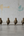 Four KIFF KIFF handcrafted brass parrot statues from India made using the traditional Dhokra lost-wax casting method.