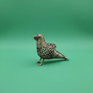 KIFF KIFF handcrafted brass parrot statuette made in India using the traditional Dhokra lost-wax casting technique.