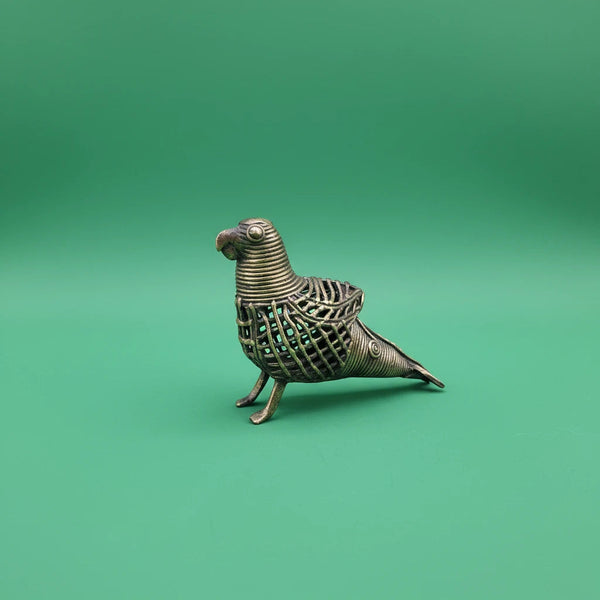 KIFF KIFF handcrafted brass parrot statuette made in India using the traditional Dhokra lost-wax casting technique.