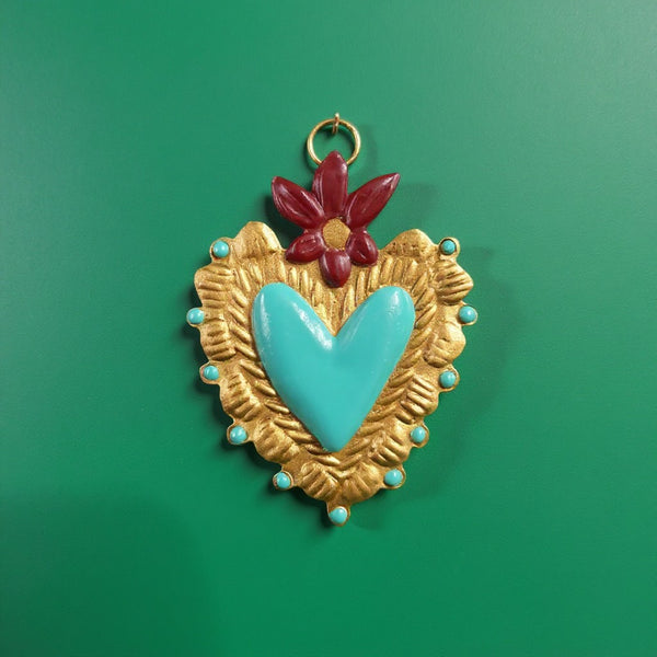 Ex-voto KIFF KIFF Betty en forme de cœur sacré doré avec centre turquoise et fleur bordeaux, fait main en métal.