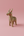 KIFF KIFF gold-toned metal deer statuette with intricate wire-wrapped texture on a soft pink background.