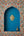 KIFF KIFF Freddy gold metal heart ex-voto with LOVE inscription displayed in a blue arched wall niche
