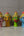 Quatre statuettes KIFF KIFF en papier mâché représentant des visages hindous peints à la main aux couleurs vives