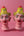 Deux statuettes KIFF KIFF en papier mâché représentant des visages hindous peints à la main dans des tons rose et or.