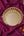 KIFF KIFF Zoya circular mirror with a decorative gold metal frame, displayed on a purple fabric background.