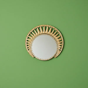 KIFF KIFF Zoya circular wall mirror with a decorative gold metal frame featuring artisanal cut-out details.