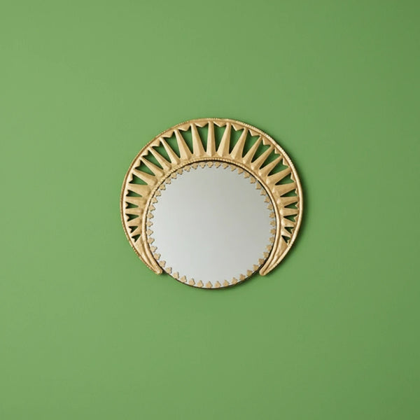 KIFF KIFF Zoya circular wall mirror with a decorative gold metal frame featuring artisanal cut-out details.